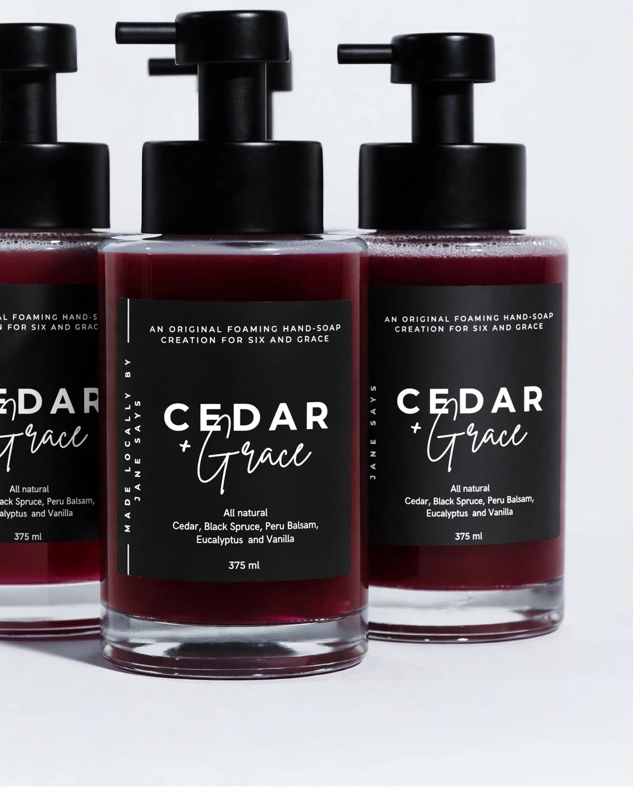 Burgundy ‘Cedar and Grace’ foaming hand soap in pump bottles