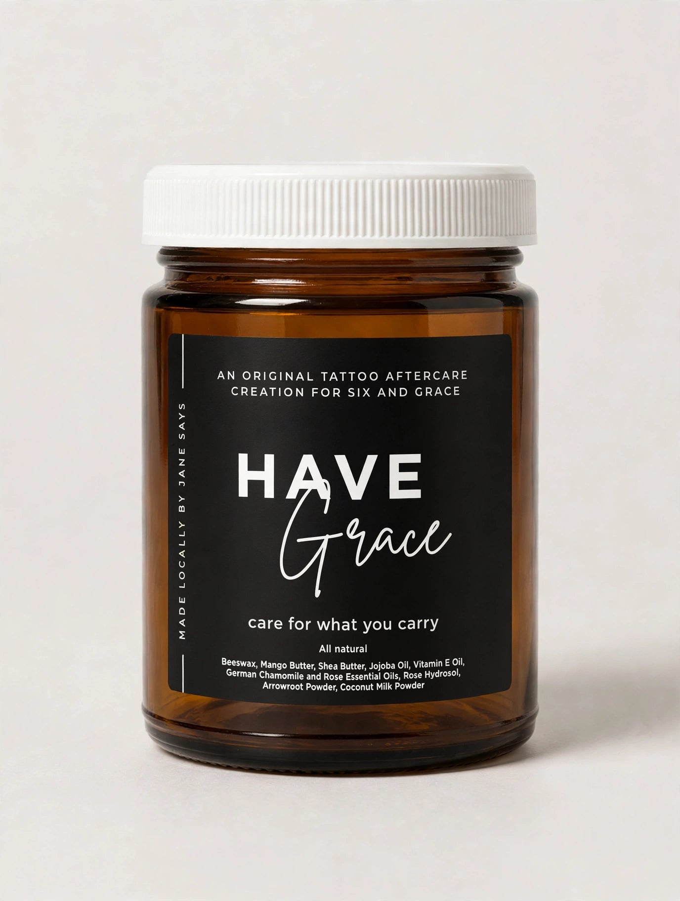 Closed amber jar of ‘Have Grace’ tattoo aftercare